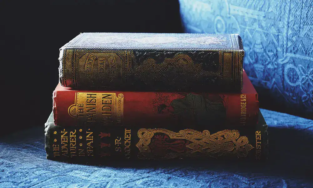 Rare antiquarian books stacked on a table