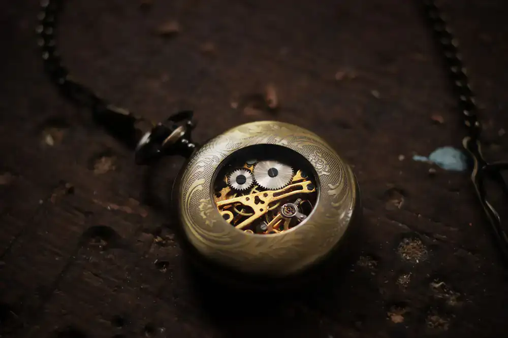Detailed close up of an antique gold pocket watch
